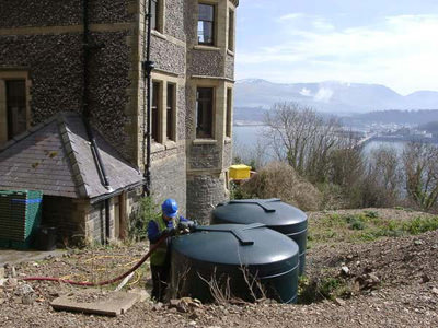 Filling up a customer's oil tank